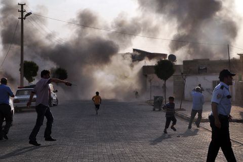 Smoke rises after the explosion on Wednesday. <a href="http://www.cnn.com/2012/07/16/middleeast/gallery/syria-unrest/index.html" target="_blank">See photos of Syria's civil fighting.</a>