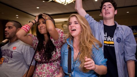 College students in Northfield, Minnesota, react on November 4, 2008, as it's announced Barack Obama was elected president.