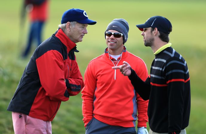 Bill Murray, left, talks with swimming legend Michael Phelps (right). The veteran actor made one of the most famous golf comedy films with 1980's Caddyshack.