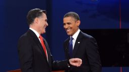 US President Barack Obama (R) greets Republican presidential candidate Mitt Romney (L) following the first presidential debate at Magness Arena at the University of Denver in Denver, Colorado, October 3, 2012. After hundreds of campaign stops, $500 million in mostly negative ads and countless tit-for-tat attacks, Obama and Romney went head-to-head in their debut debate. AFP PHOTO / Saul LOEB (Photo credit should read SAUL LOEB/AFP/GettyImages) 