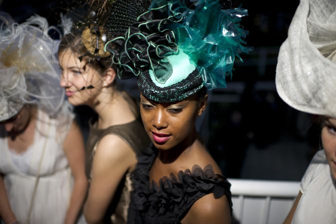 The fashion stakes are high at the Prix de 'Arc de Triomphe, with many race-goers opting for a classic, elegant style.