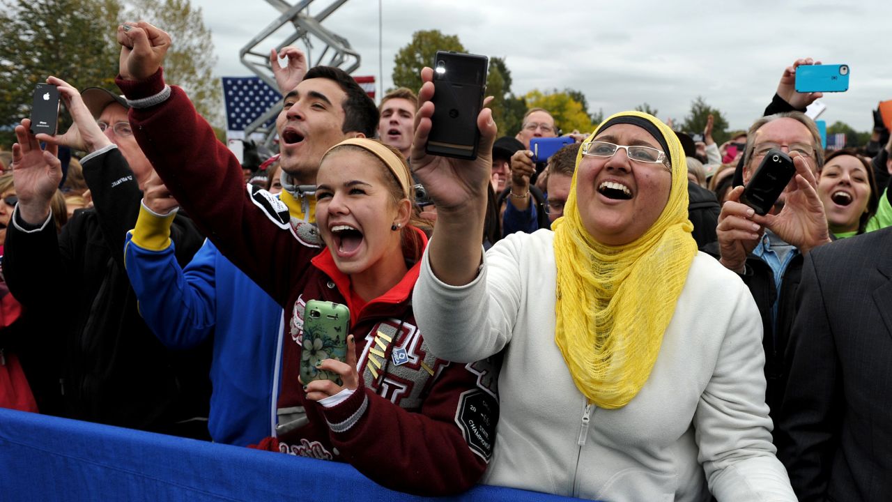 Audience members cheer as Obama makes his way onto the stage at Sloan's Lake Park in Denver on Thursday.