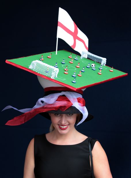 Some fashion racing accessories appear universal -- such as the obligatory outrageous hat. A Royal Ascot punter dons a football-themed hat at this year's races.