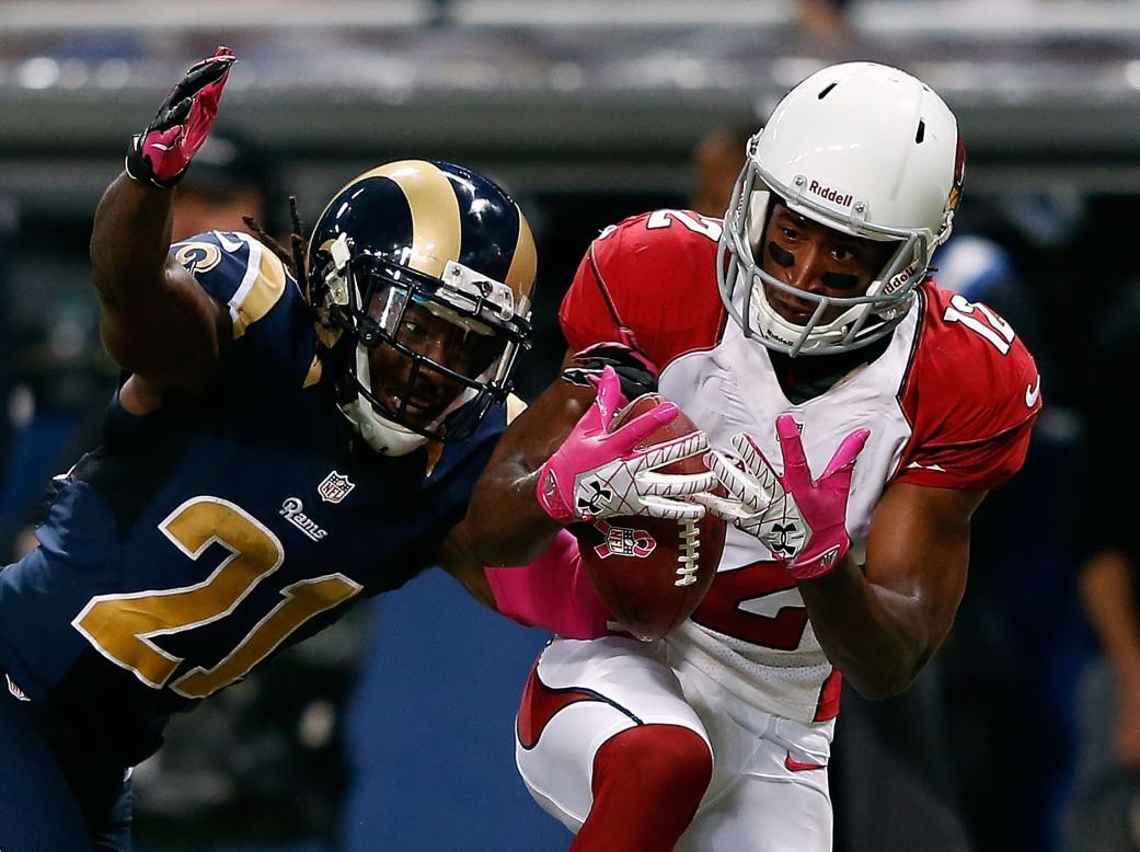 Janoris Jenkins of the St. Louis Rams breaks up a pass intended for Andre Roberts of the Arizona Cardinals.