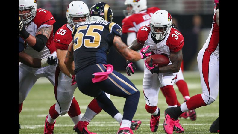 Ryan Williams of the Arizona Cardinals rushes against the St. Louis Rams on Thursday. The Rams handed Arizona its first loss of the season, 17-3.