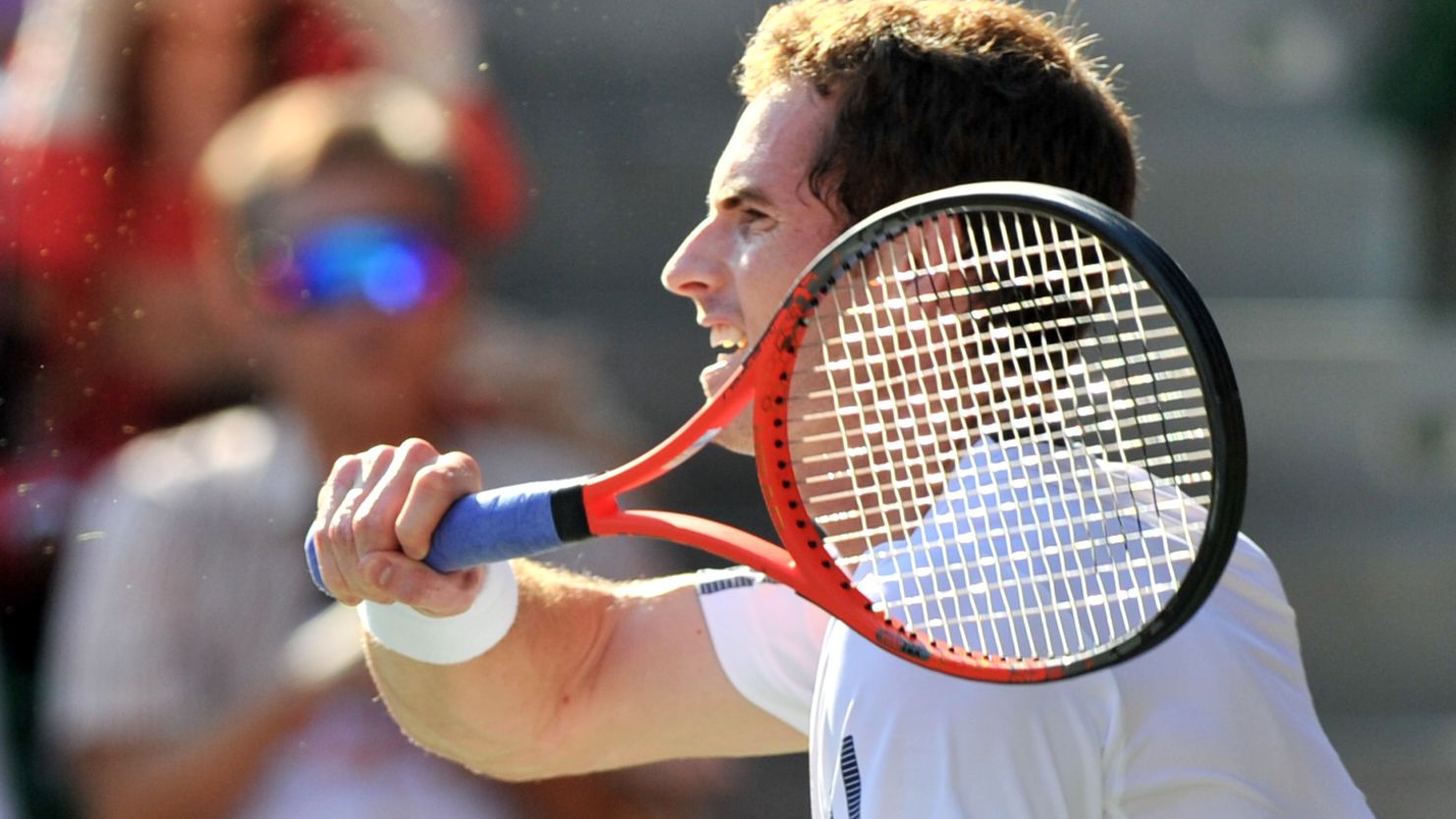 Andy Murray strikes a forehand during his three set win over Stanislas Wawrinka in Tokyo.
