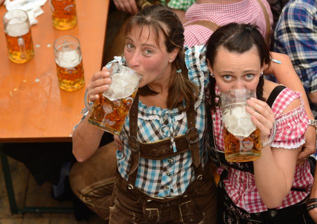 Oktoberfest visitors get into the spirit in a festival tent at the Theresienwiese on Friday.