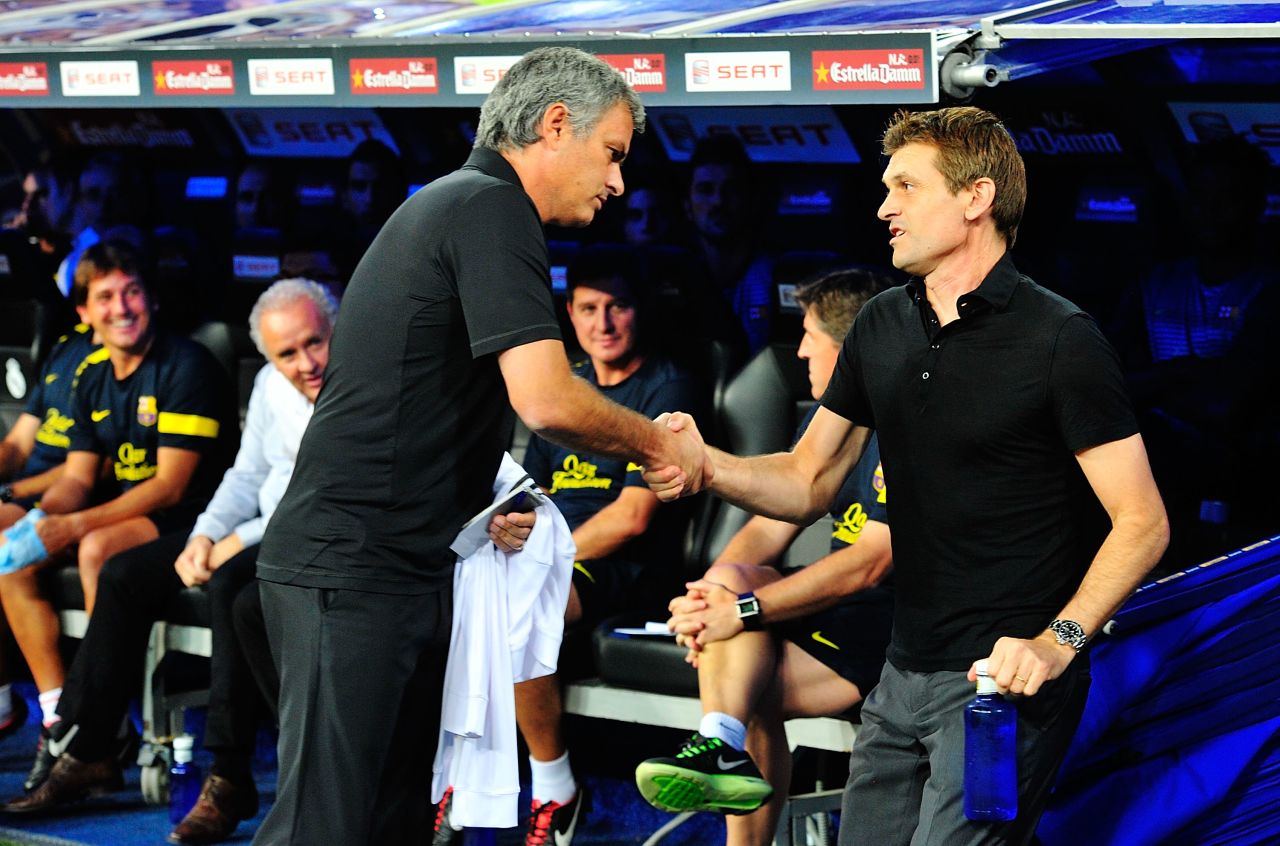 Real Madrid manager Jose Mourinho (left) and Barcelona manager Tito Vilanova (right) shake hands at the derby between the two clubs. Real's revenue is $695 million, $42 million more than Barca and $526 million more than that of Valencia.