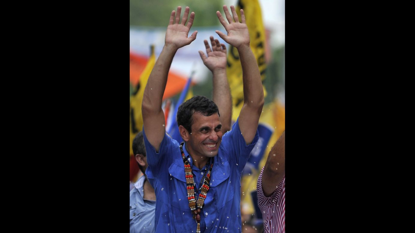 Capriles greets supporters during a Thursday's campaign rally in San Carlos.
