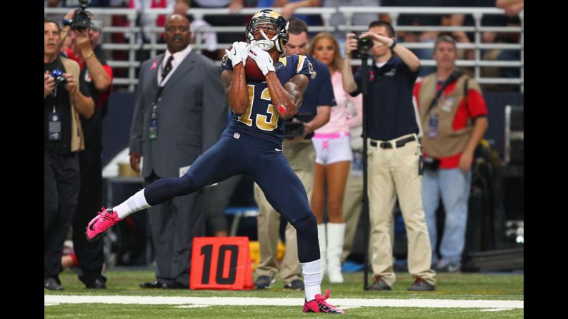 Chris Givens of the Rams catches a touchdown pass on Thursday against the Arizona Cardinals.