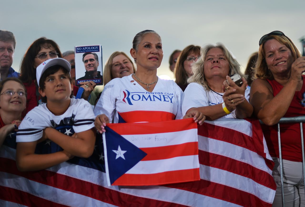 Romney supporters listen during Friday's campaign event in St. Petersburg.