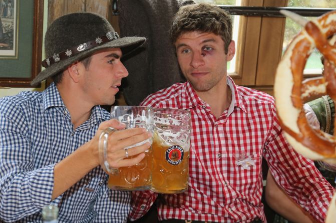 Philipp Lahm, left, of the German football team Bayern Munchen attends the Oktoberfest beer festival with his teammate Thomas Mueller in Munich, Germany, on Sunday, October 7, the last day of the world's biggest beer festival. <a href="index.php?page=&url=http%3A%2F%2Fwww.cnn.com%2FSPECIALS%2Fworld%2Fphotography%2Findex.html">See more of CNN's best photography.</a>
