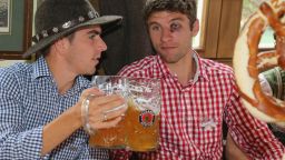 Philipp Lahm, left, of the German football team Bayern Munchen attends the Oktoberfest beer festival with his teammate Thomas Mueller in Munich, Germany, on Sunday, October 7, the last day of the world's biggest beer festival. See more of CNN's best photography.