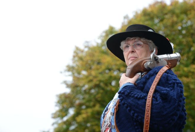 A Bavarian riflewoman waits before the salute on Sunday.
