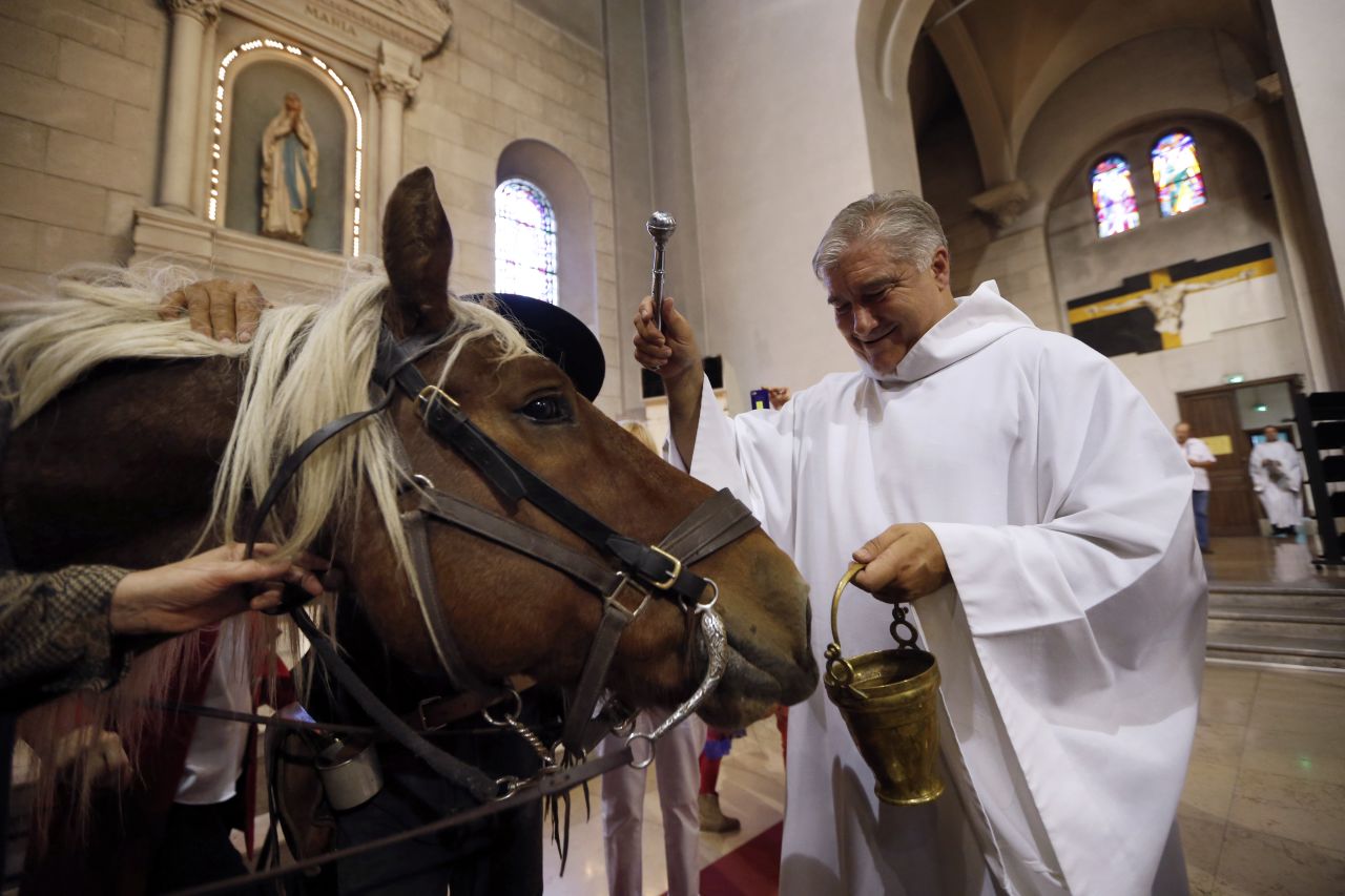 Gil Florini, priest of St.-Pierre-d'Arene Church, blesses a horse during a Mass dedicated to animals to honor the feast of St. Francis of Assisi on Sunday, October 7, in Nice, France. Catholic churches around the world hold annual blessings of pets on the feast day of Francis, the patron saint of animals. <a href="http://www.cnn.com/SPECIALS/world/photography/index.html" target="_blank">Check out more of CNN's best photography.</a>