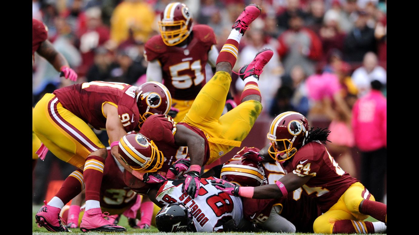 Harry Douglas of the Atlanta Falcons is hit by multiple Washington Redskins defenders.