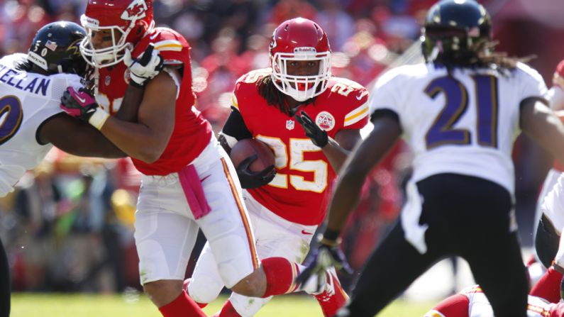 Jamaal Charles of the Kansas City Chiefs powers through the Baltimore Ravens defense.