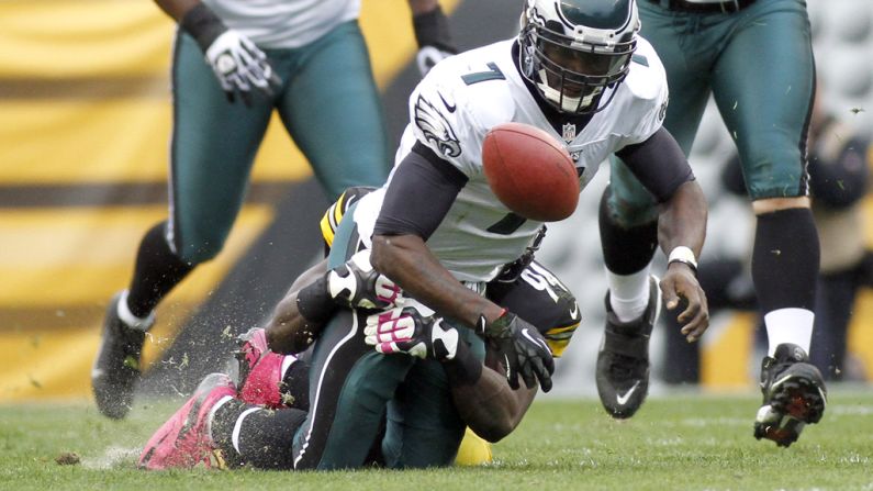 Lawrence Timmons of the Steelers rips the ball from Eagles quarterback Michael Vick on Sunday.