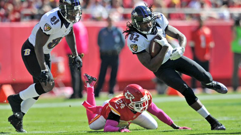 Torrey Smith of the Baltimore Ravens turns up field past Brandon Flowers of the Kansas City Chiefs in the first quarter Sunday.