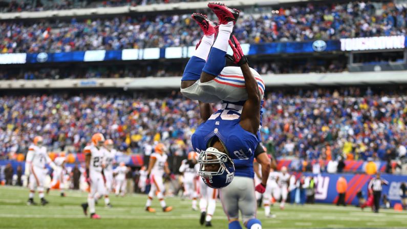 David Wilson of the New York Giants celebrates a touchdown on Sunday by doing a back flip.