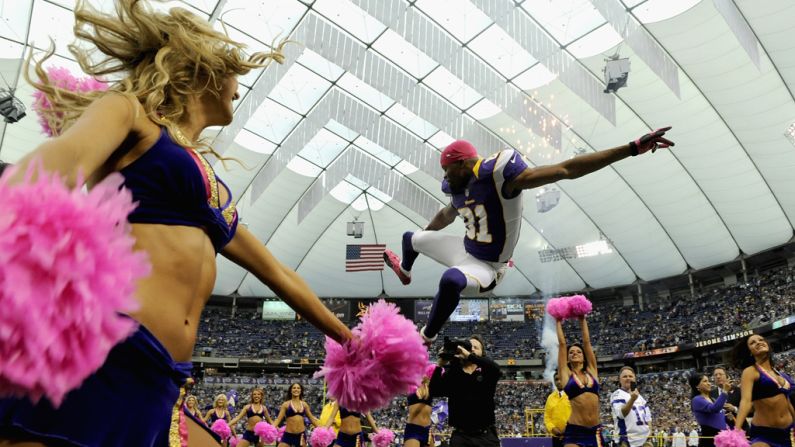 Jerome Simpson of the Minnesota Vikings jumps as he is announced before Sunday's game.