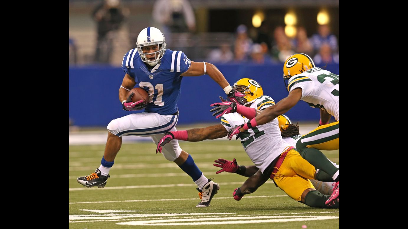 Donald Brown of the Colts breaks a tackle on Sunday.