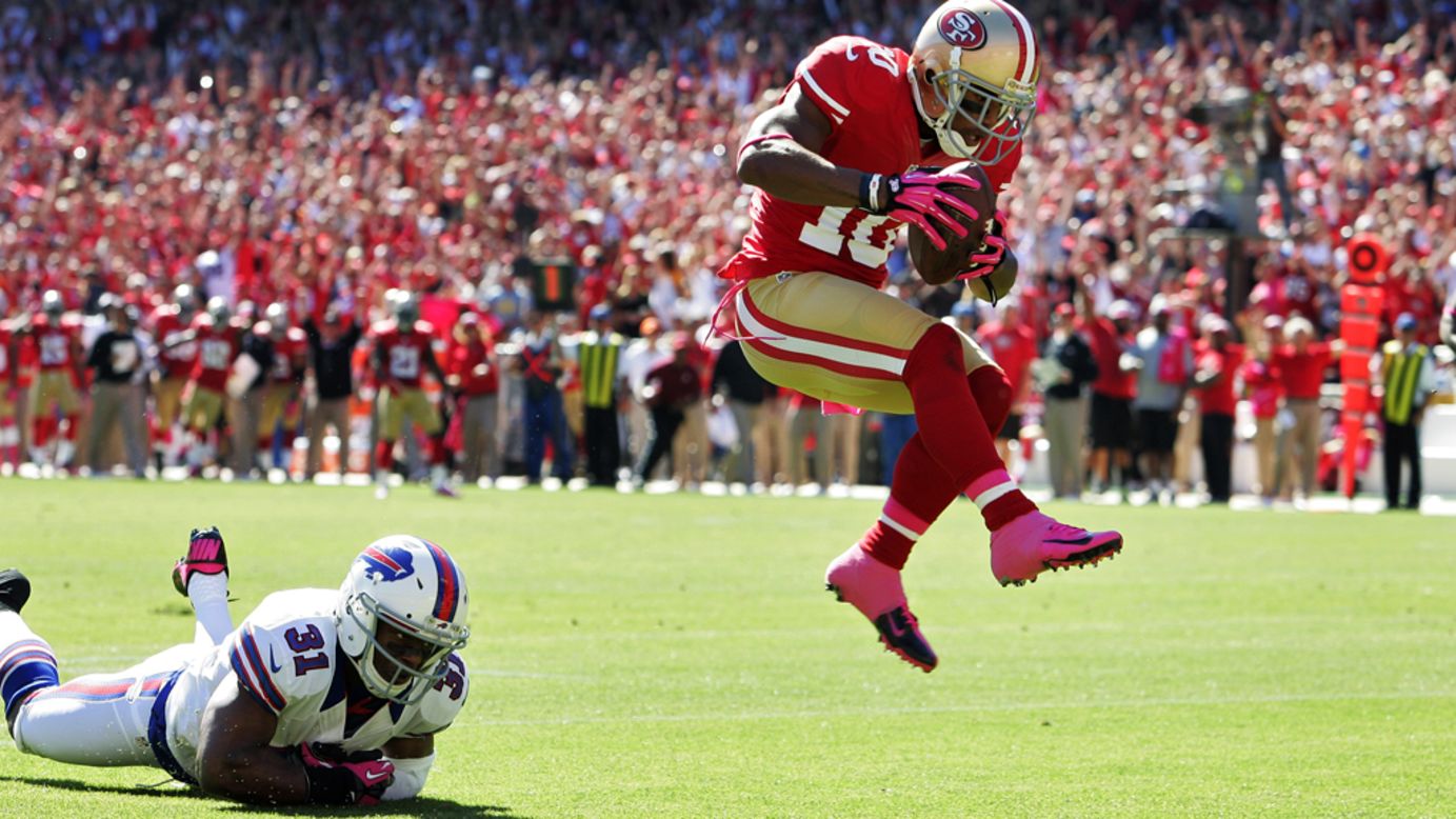 Kyle Williams of the San Francisco 49ers leaps into the end zone for a touchdown.