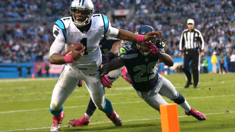 Earl Thomas of the Seattle Seahawks stops Carolina Panthers quarterback Cam Newton from getting into the end zone late in the fourth quarter on Sunday at Bank of America Stadium in Charlotte, North Carolina.
