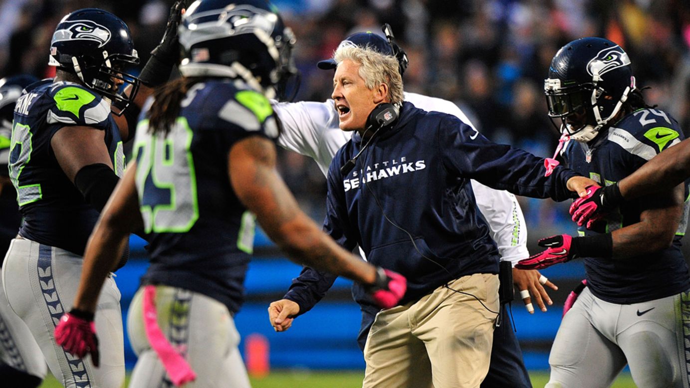 Seahawks coach Pete Carroll celebrates with his defense late in Sunday's game against the Panthers.