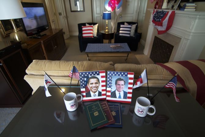 Framed photos of Barack Obama and Mitt Romney decorate a table in a politically inspired suite at the Mayflower Hotel in Washington.
