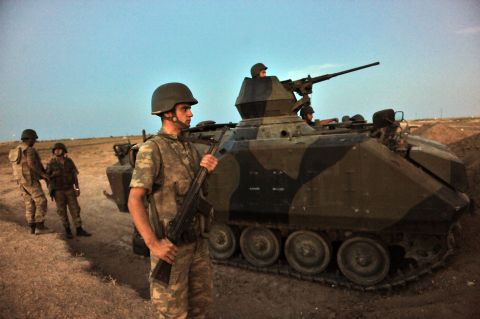 Turkish soldiers stand guard in Akcakale on Thursday, October 4. The stray shelling along the border has prompted Turkey to respond with threats and weapons fire, fueling concerns the Syrian civil war will bleed into a greater regional battle.