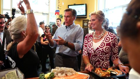 Republican presidential candidate Mitt Romney and his wife, Ann, greet workers at the Tin Fish restaurant following a rally Sunday in Port St. Lucie, Florida.