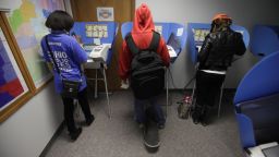 Voters cast their ballots, during early voting at the Wood County Court House in Bowling Green, Ohio on October 2.