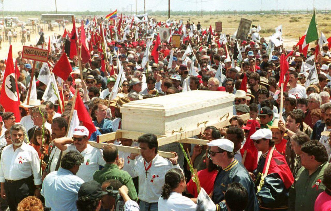 An estimated 25,000 mourners accompany Chavez's pine casket to his funeral Mass in Delano, California, in 1993.