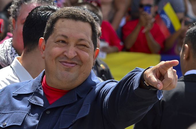 Chavez greets a crowd before voting Sunday. The 58-year-old leader has been weakened by two surgeries for cancer, keeping secret the type of cancer and his prognosis. <a href="index.php?page=&url=http%3A%2F%2Fwww.cnn.com%2F2012%2F10%2F03%2Famericas%2Fgallery%2Fvenezuela-election%2Findex.html" target="_blank">Photos: Venezuela's presidential vote</a>