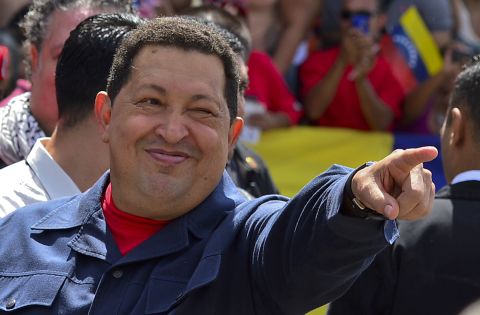 Chavez greets a crowd before voting Sunday. The 58-year-old leader has been weakened by two surgeries for cancer, keeping secret the type of cancer and his prognosis. <a href="http://www.cnn.com/2012/10/03/americas/gallery/venezuela-election/index.html" target="_blank">Photos: Venezuela's presidential vote</a>