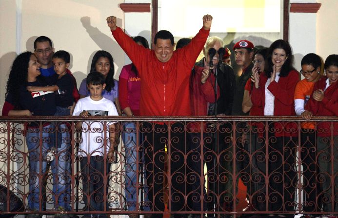 Venezuelan President Hugo Chavez greets supporters after receiving news of his re-election in Caracas on Sunday, October 7. With 90% of the ballots counted, Chavez, who has been president since 1999, defeated Henrique Capriles Radonski with 54.42% of the votes, according to an National Electoral Council official.<a href="index.php?page=&url=http%3A%2F%2Fwww.cnn.com%2F2012%2F10%2F03%2Famericas%2Fgallery%2Fvenezuela-election%2Findex.html" target="_blank"> Photos: Venezuela's presidential vote</a>