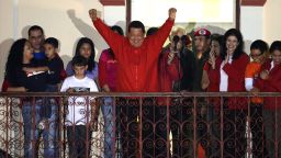 Venezuelan President Hugo Chavez (C) gestures while speaking to supporters after receiving news of his reelection in Caracas on October 7, 2012. According to the National Electoral Council, Chavez was reelected with 54.42% of the votes, beating opposition candidate Henrique Capriles, who obtained 44.47%. AFP PHOTO/JUAN BARRETO (Photo credit should read JUAN BARRETO/AFP/GettyImages)