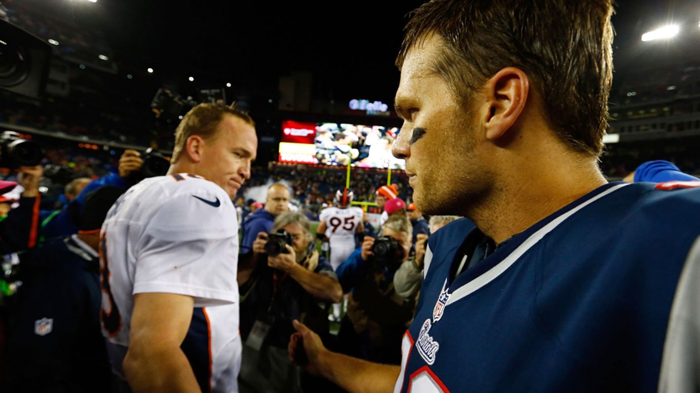 Patriots quarterback Tom Brady greets Broncos quarterback Peyton Manning midfield following Sunday's game.