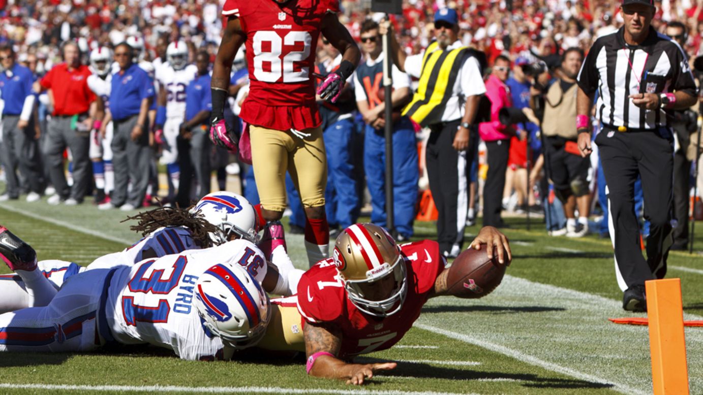 Quarterback Colin Kaepernick of the 49ers is stopped short of the goal line by Jairus Byrd of the Bills.