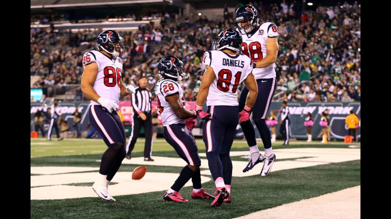 Owen Daniels is congratulated by his teammates.