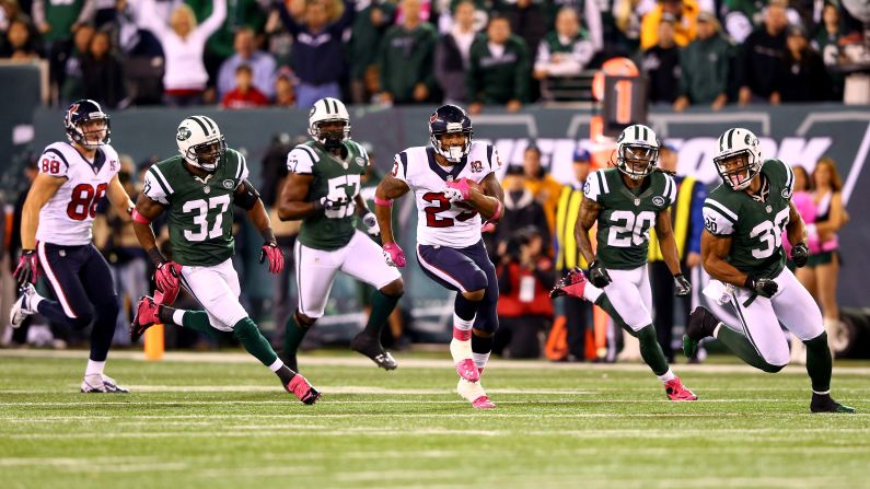 The Texans' Arian Foster runs the ball down the field in the first quarter.