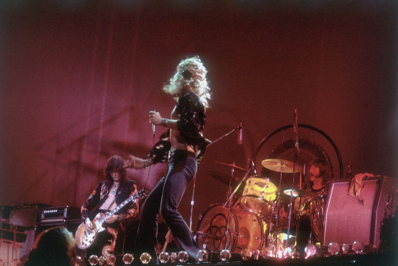 Led Zeppelin's Jimmy Page, Robert Plant and John Bonham perform in 1977. The legendary British rock group disbanded after Bonham's death in 1980 but remains one of the most influential bands of its era. A promoter allegedly offered Page, Plant and bassist John Paul Jones $800 million for a reunion tour, but Plant reportedly turned it down.