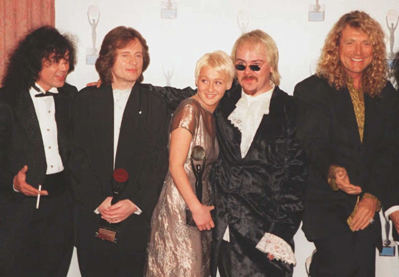 Page, Jones and Plant are joined by the late Bonham's children, Zoe and Jason, after the group's induction into the Rock and Roll Hall of Fame in 1995.