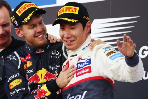 Race winner Sebastian Vettel congratulates third-placed Kobayashi on his maiden podium finish. Kobayashi made his Grand Prix debut in 2009. 