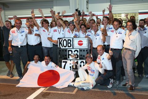 Kobayashi celebrates with teammates as Sauber close the gap on fifth-placed Mercedes in the constructors' championship. 