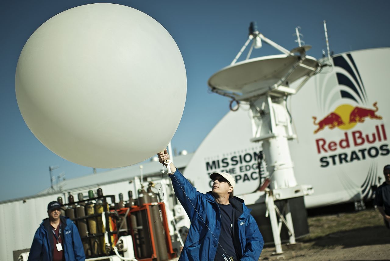 A crew member launches a weather balloon into the stratosphere on Thursday, October 4.