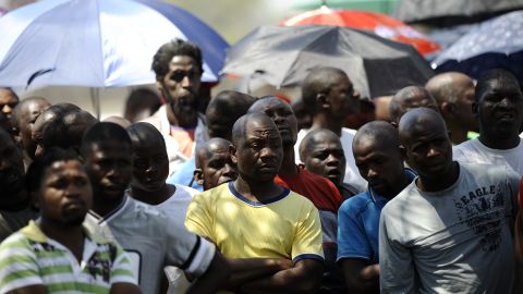 Striking mine workers gather outside the Anglo American Mine on Friday, October 5 in Rustenburg, South Africa.