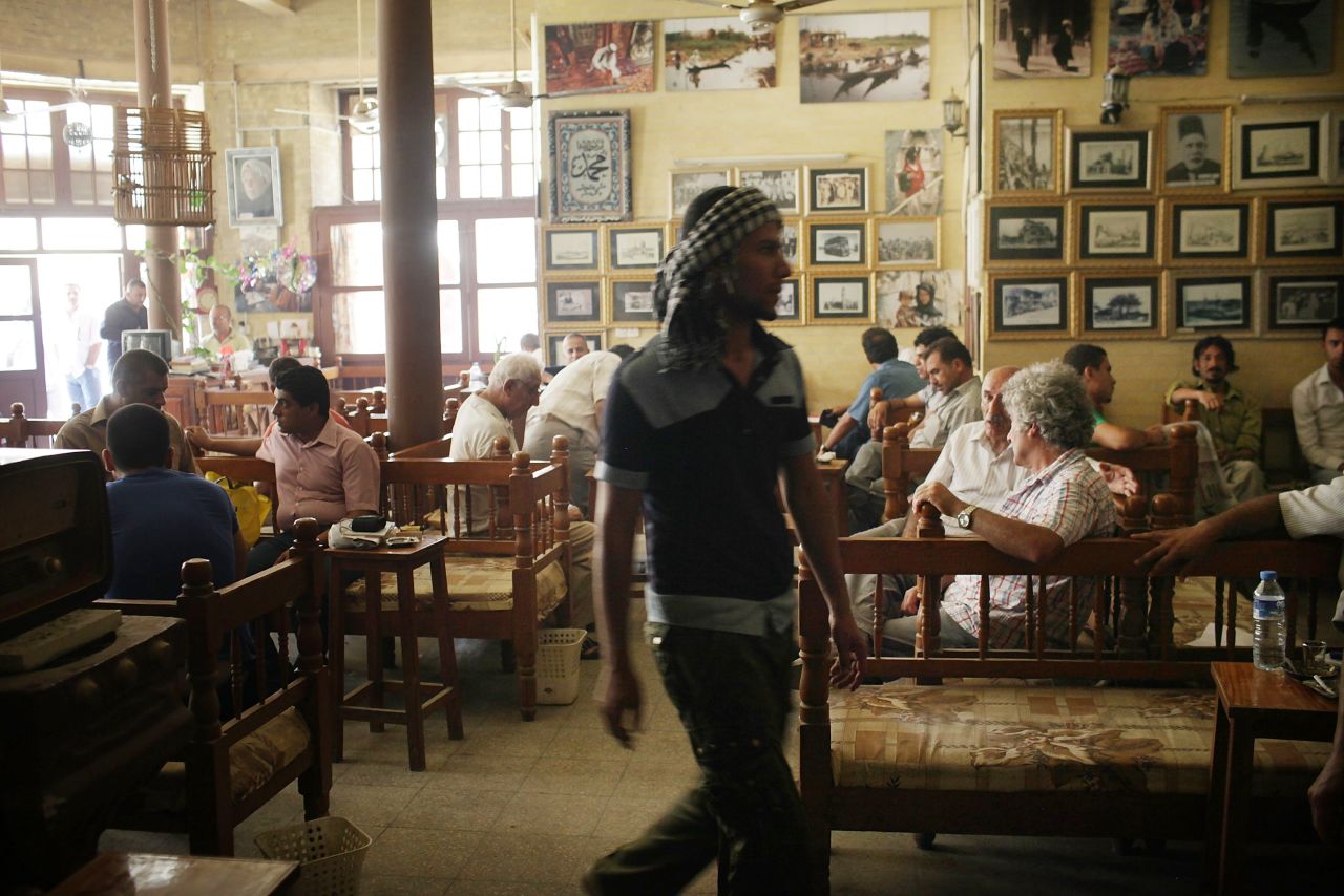 People enjoy an afternoon at the Al-Shah Bender Cafe, one of the oldest tea shops -- and a legendary gathering place for Iraqi artists and writers -- in Baghdad in 2011.  