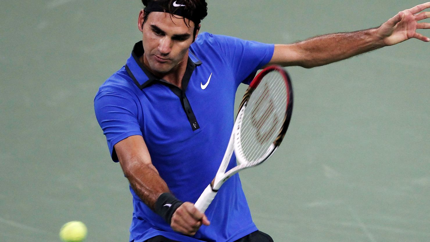 Roger Federer plays a backhand return during his second round victory over Yen-Hsun Lu at the Shanghai Masters. 